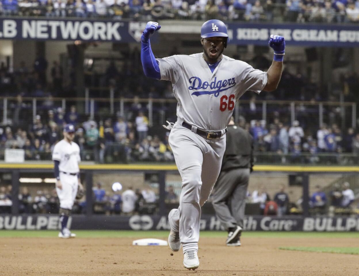 Dodgers Yasiel Puig celebrates after hitting a three run homerun in the 6th inning.