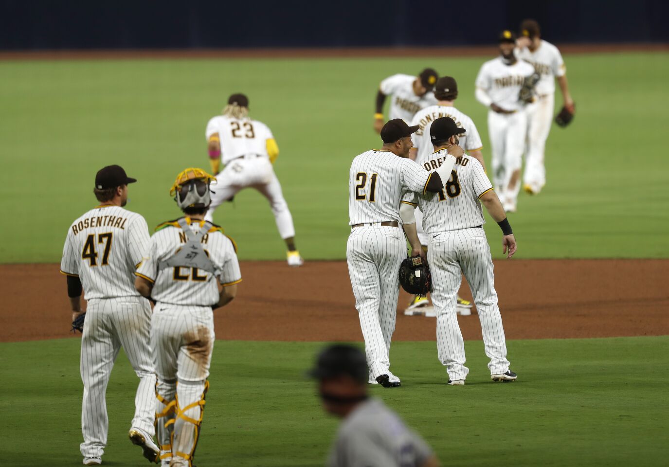 The San Diego Padres celebrate beating the Colorado Rockies 5-3 at Petco Park on Wednesday, Sept. 9, 2020.