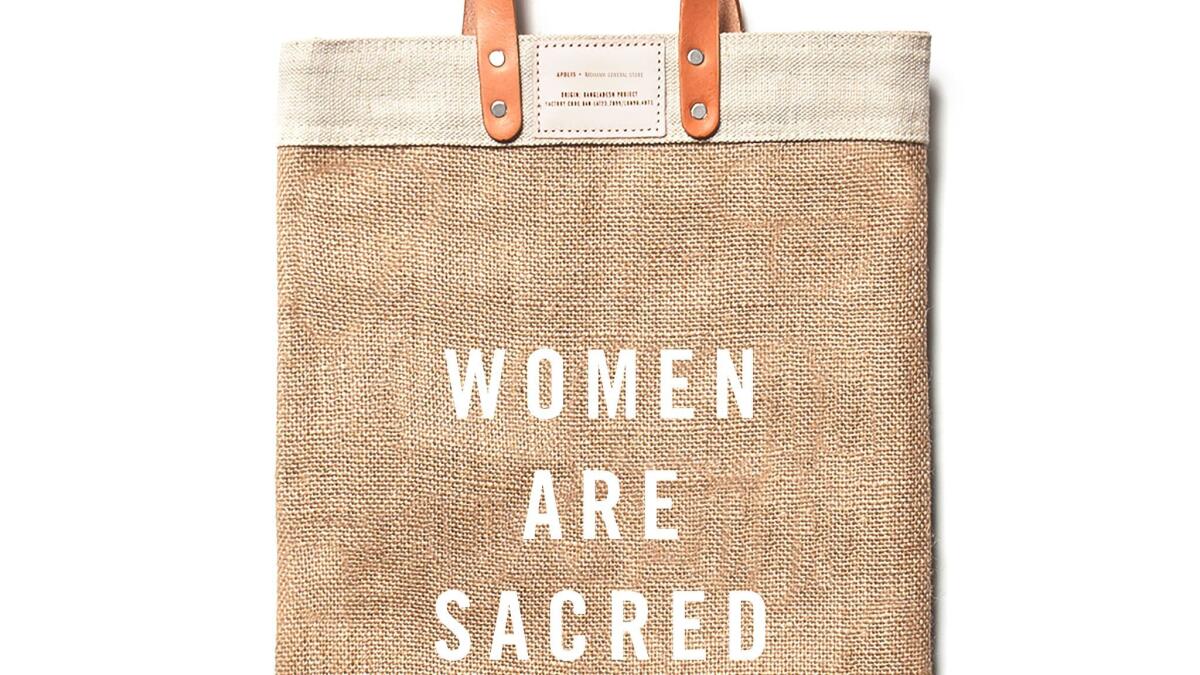 "Women Are Sacred' tote bags benefit charity groups.