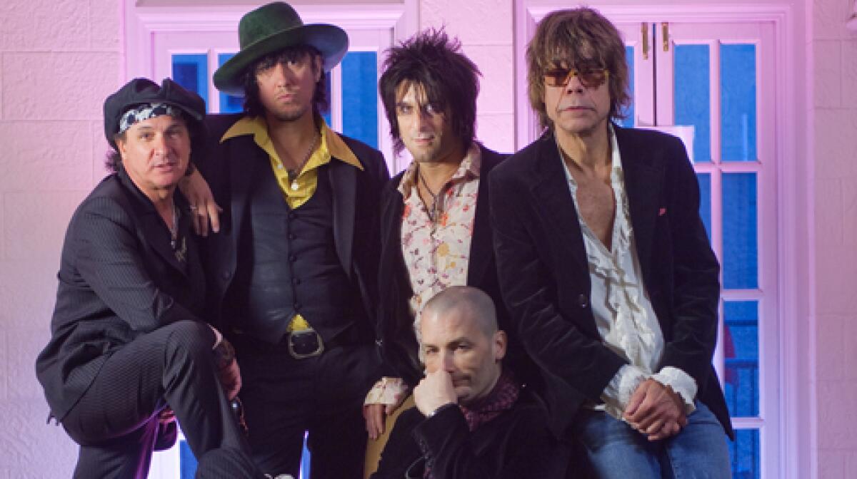 The New York Dolls, from left: Sylvain Sylvain, Sami Yaffa, Steve Conte, Brian Delaney (seated) and David Johansen.