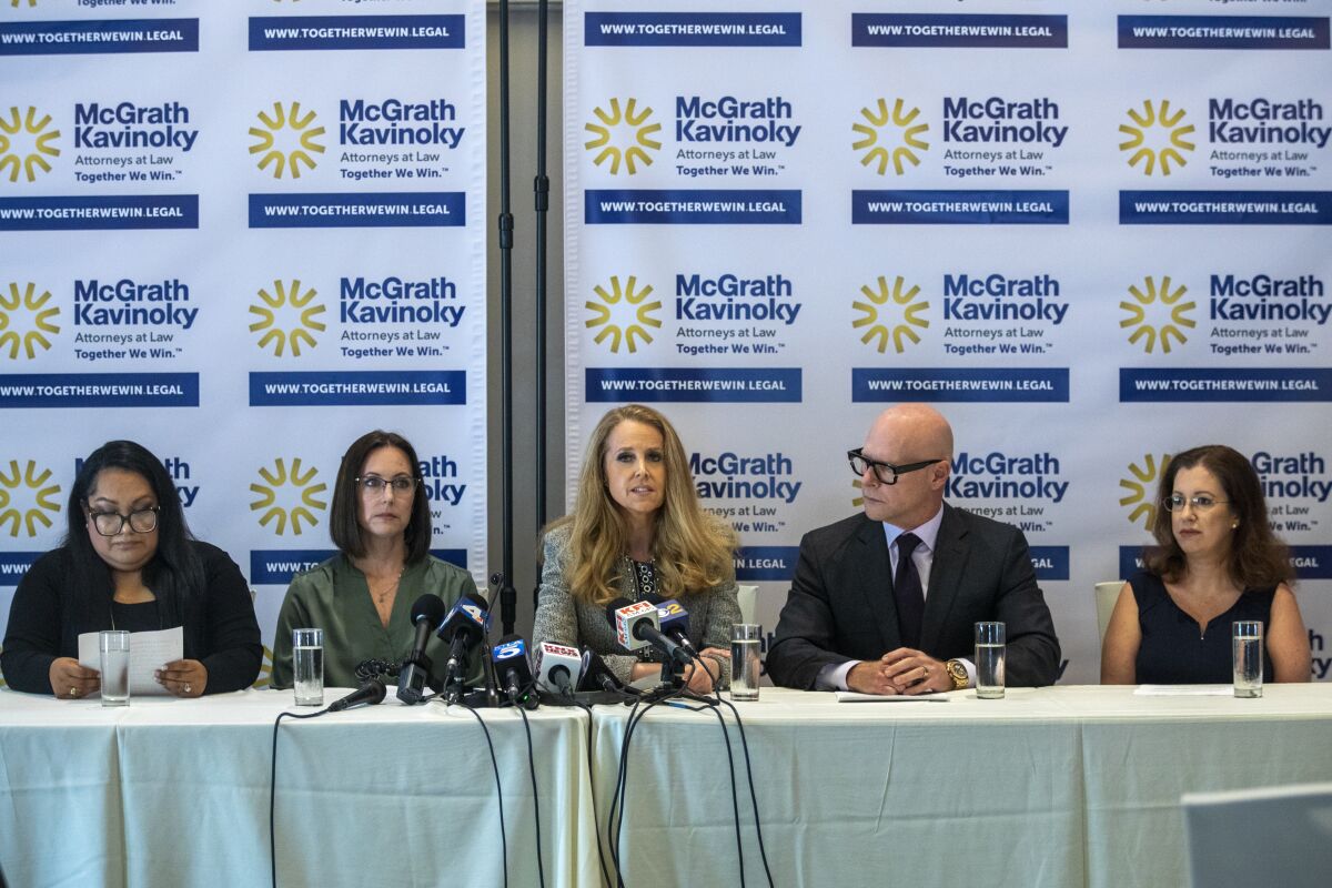 Gabby, (left-right) Ellen, attorney Jennifer J. McGrath, attorney Darren Kavinoky, and Julie