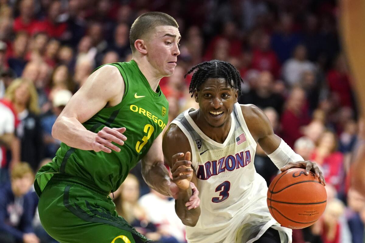 Arizona's Dylan Smith drives on Oregon's Payton Pritchard on Feb. 22, 2020.