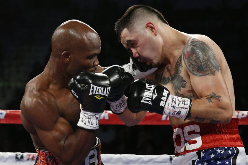 Timothy Bradley works inside against Brandon Rios during their WBO welterweight title bout Saturday.