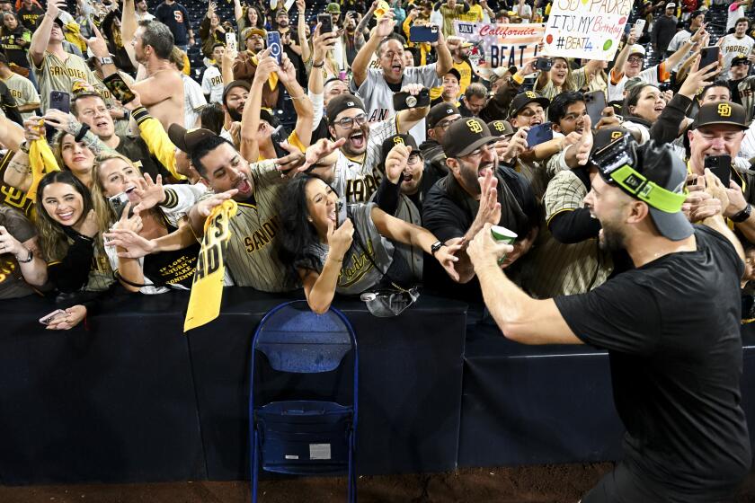 San Diego, CA - October 15: The San Diego Padres fans celebrate after the Padres beat.