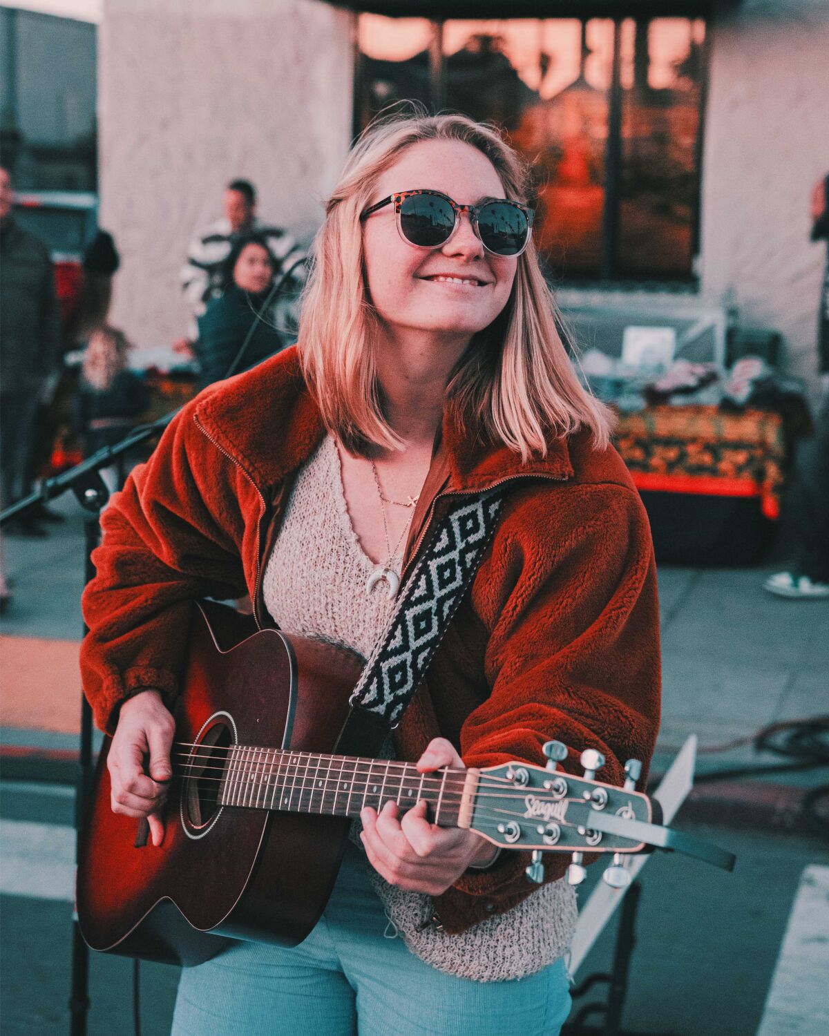 Ocean Beach musician Paige Koehler performs at an outdoor gig.