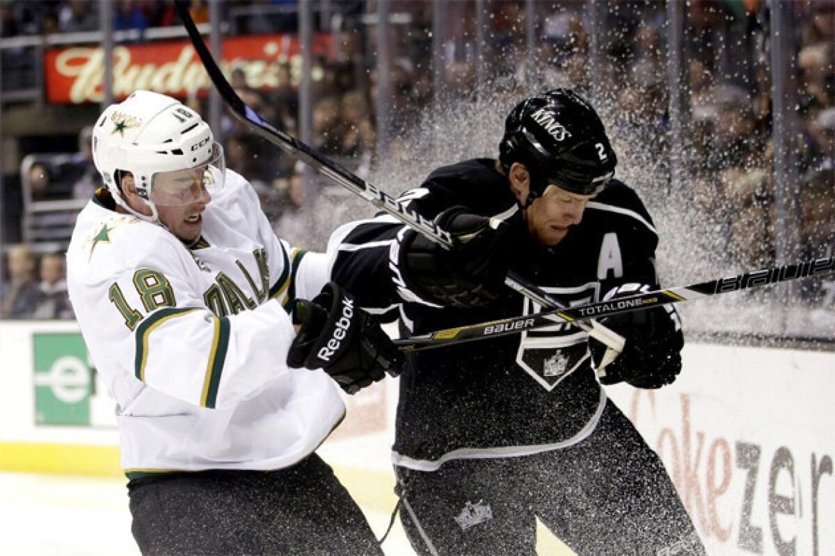 Dallas Stars' Reilly Smith, left, collides with Kings' Matt Greene during the first period.