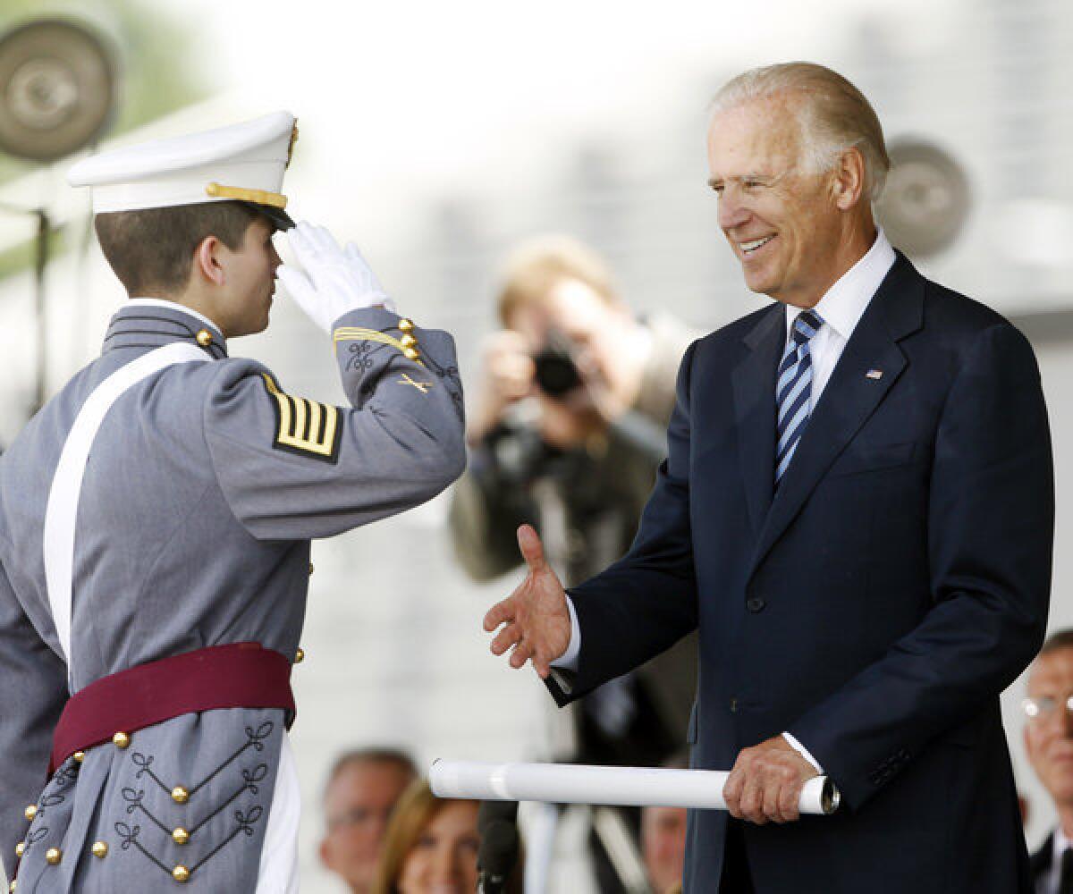 Vice President Joe Biden presents a diploma to valedictorian Alexander George Pagoulatos during a graduation and commissioning ceremony at the U.S. Military Academy in West Point, N.Y.
