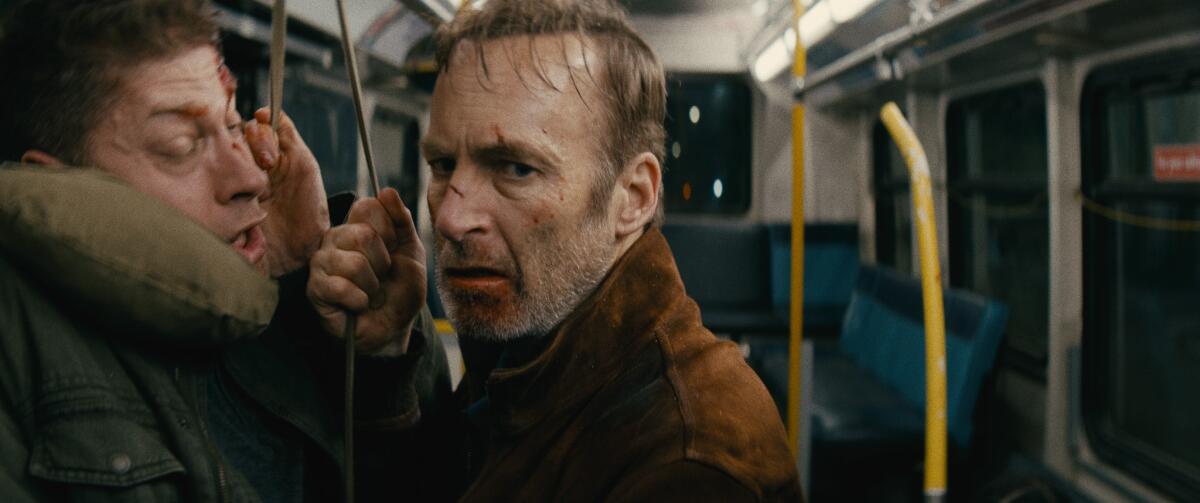 Bob Odenkirk, with a blood-spattered face, reveals his very special set of action skills in "Nobody."