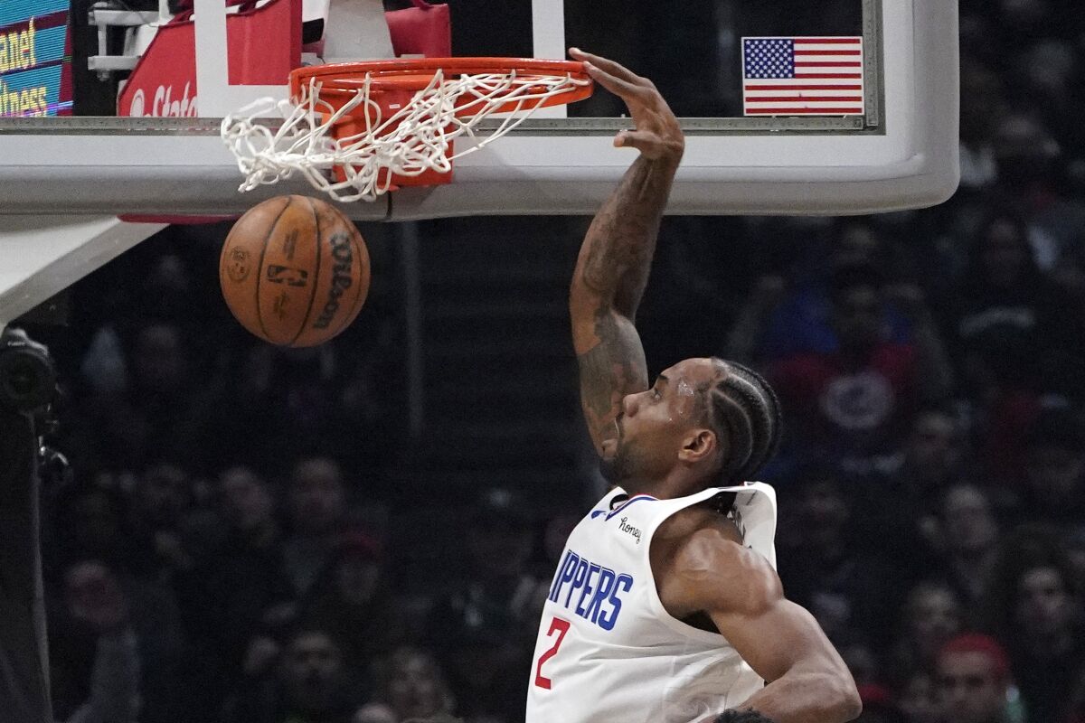 Clippers forward Kawhi Leonard dunks during the first half against the Atlanta Hawks.