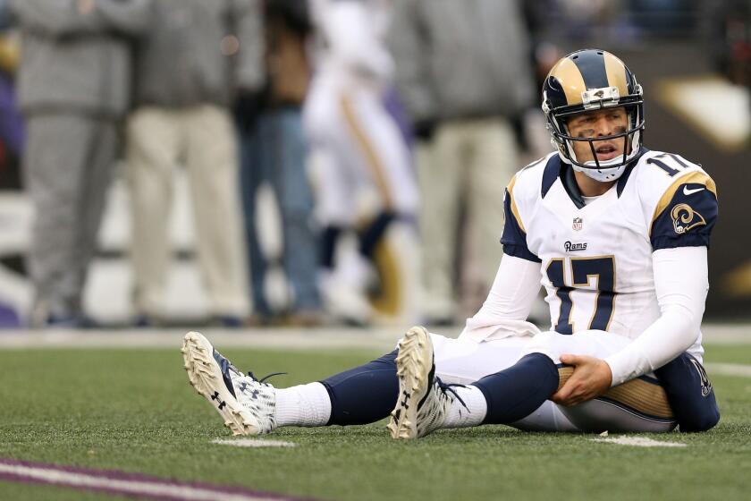 Rams quarterback Case Keenum sits on the turf after a play against the Ravens in the fourth quarter.