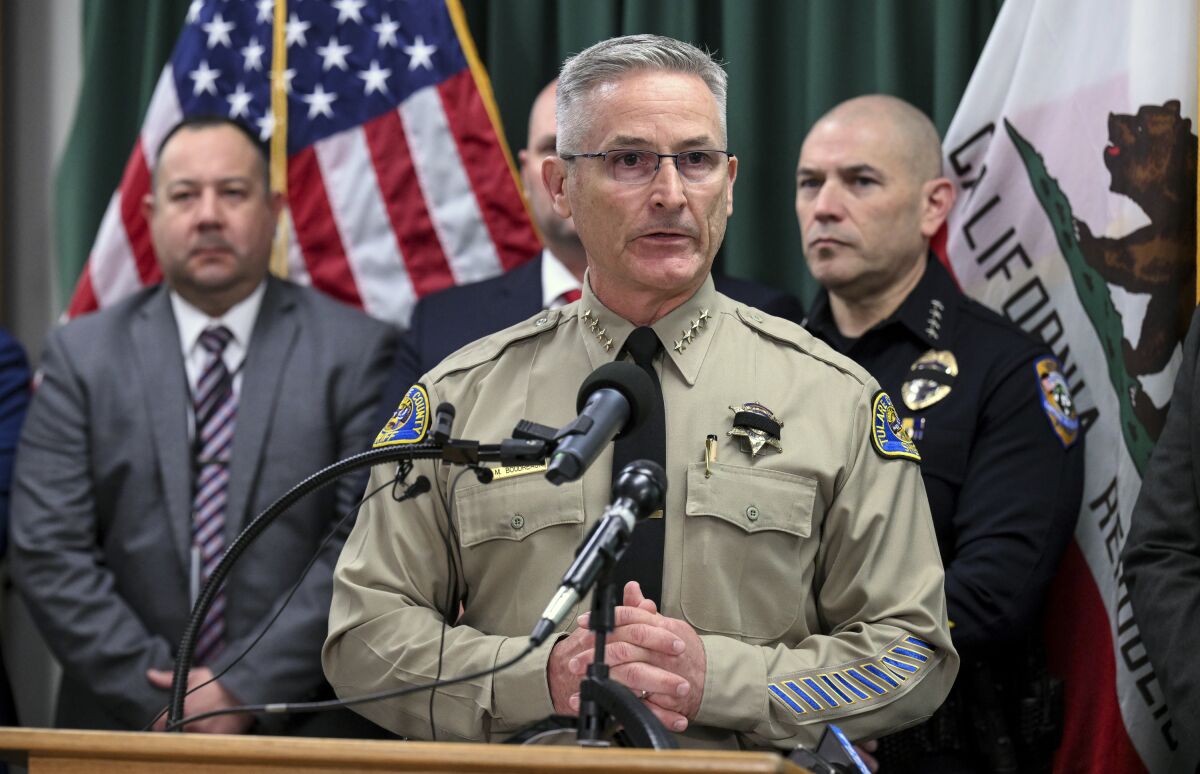 Tulare County Sheriff Mike Boudreaux announces the arrests of two suspects in the Jan. 16 homicide of six people in Goshen, Calif., during a news conference in Visalia, Calif., Friday, Feb. 3, 2023. One suspect was apprehended in Visalia, the other just blocks away from the crime scene. (Ron Holman/The Times-Delta via AP)