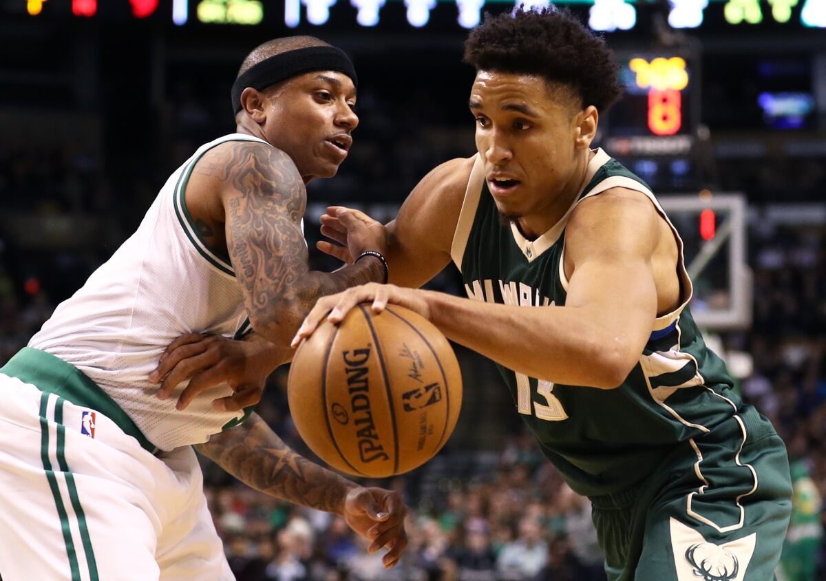 Bucks rookie guard Malcolm Brogdon drives past Celtics guard Isaiah Thomas during a game at TD Garden on March 29, 2017.