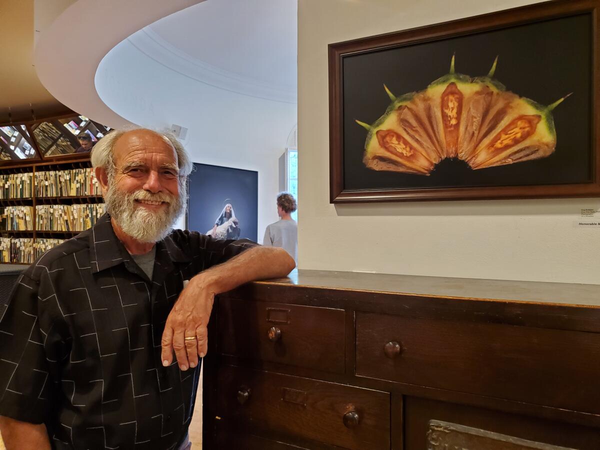 Artist Greg Kalajian displays his work in the Athenaeum Music & Arts Library's 2022 Juried Exhibition.
