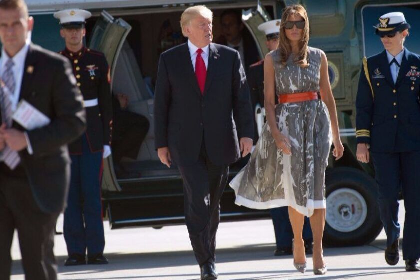 TOPSHOT - US President Donald Trump and US First Lady Melania Trump make their way from Marine One to board Airforce One after the G20 Summit in Hamburg, Germany, July 8, 2017. Leaders of the world's top economies gather from July 7 to 8, 2017 in Germany for likely the stormiest G20 summit in years, with disagreements ranging from wars to climate change and global trade. / AFP PHOTO / SAUL LOEBSAUL LOEB/AFP/Getty Images ** OUTS - ELSENT, FPG, CM - OUTS * NM, PH, VA if sourced by CT, LA or MoD **