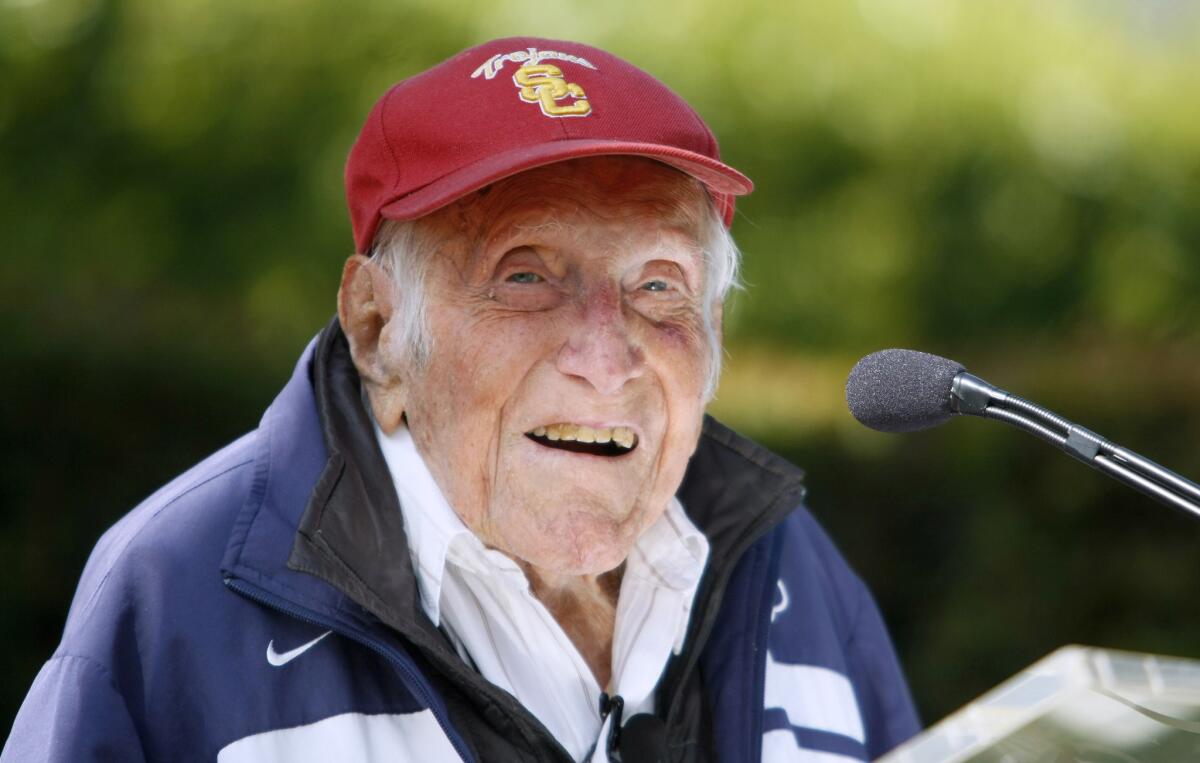 American war hero, World War II prisoner of war and olympian Louis Zamperini, center, was chosen as the Grand Marshal for the 2015 tournament of Roses, in Pasadena on Friday, May 9, 2014. Zamperini died on Wednesday, July 2, 2014.
