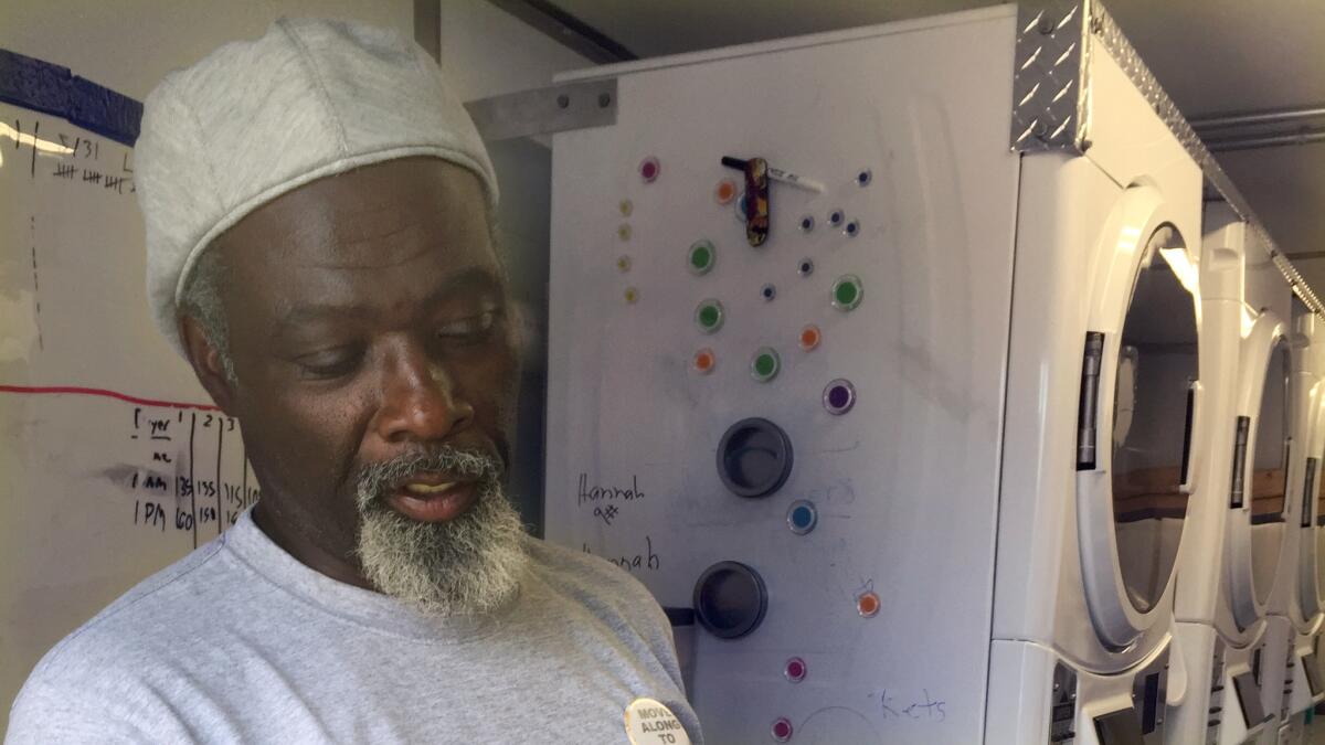 Marcus Harris, who was once homeless, runs the Laundry Truck, the mobile unit that washes clothes for Denver's homeless at no charge.