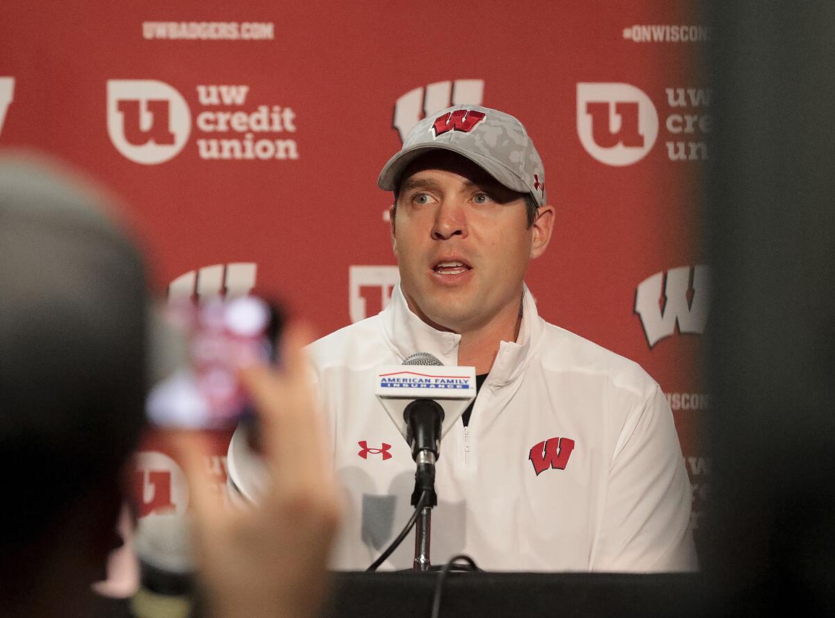 University of Wisconsin football defensive coordinator Jim Leonhard addresses reporters during a news conference announcing the firing of head coach Paul Chryst in Madison, Wis. Sunday, Oct. 2, 2022. Leonhard has been named the team's interim coach. (John Hart/Wisconsin State Journal via AP)