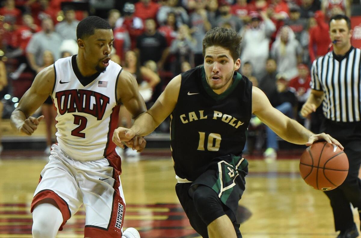 Cal Poly's Ridge Shipley brings the ball up the court against UNLV's Jerome Seagears on Friday.