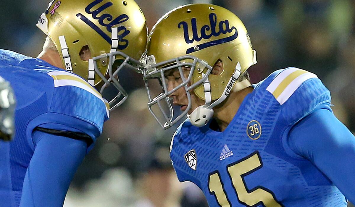 UCLA kicker Ka'imi Fairbairn (15) is congratulated by teammate Jerry Neuheisel after kicking a field goal against Cal last season.