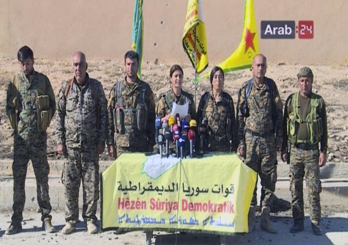 Officials with the U.S.-backed Syria Democratic Forces at a press conference in Ein Issa in northern Syria.
