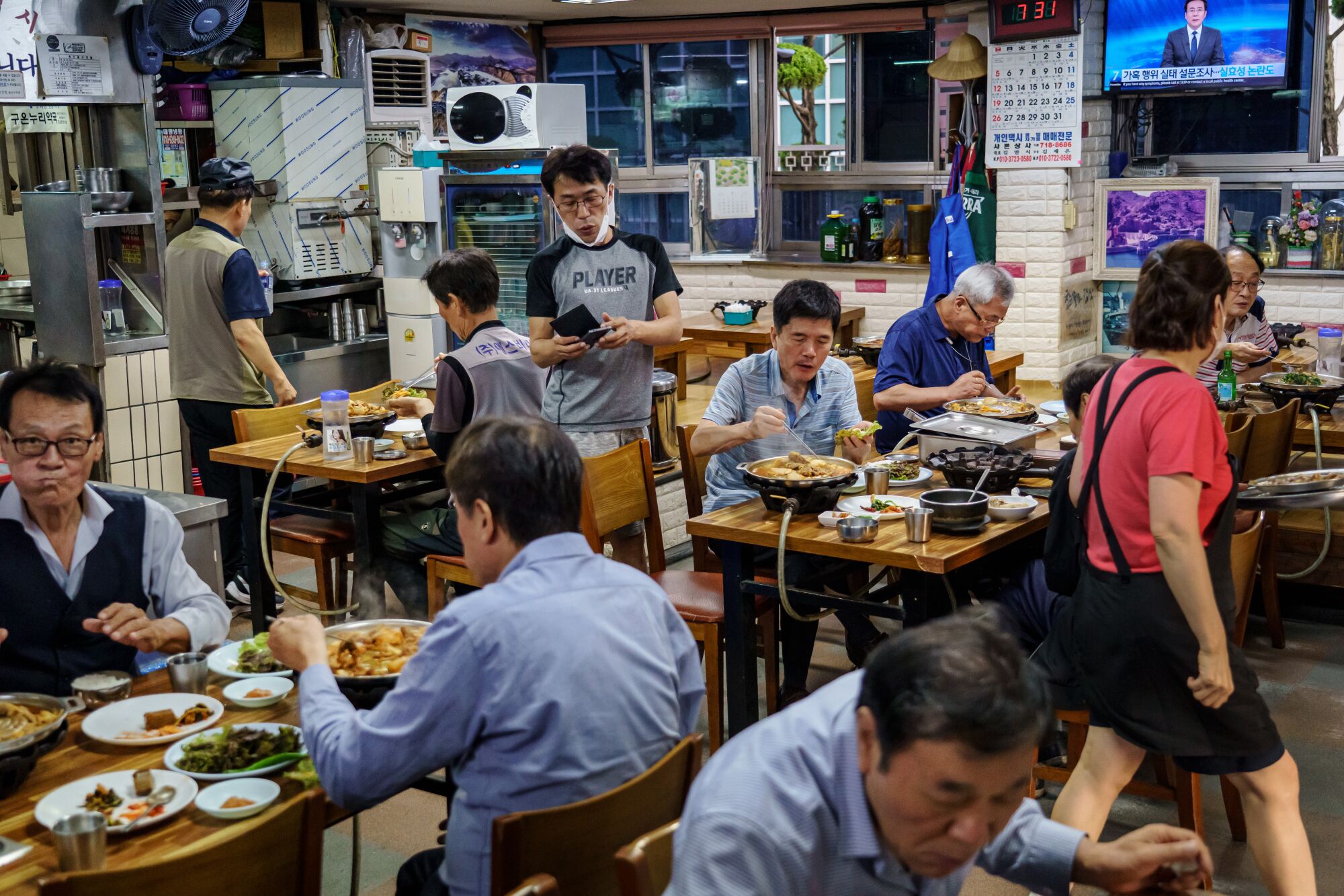 Taxi drivers dine on kimchi and bulgogi at Ilsin Gisa Sikdang restaurant in Seoul. 