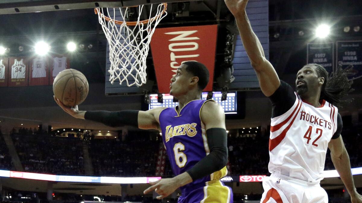 Lakers guard Jordan Clarkson attempts a reverse layup against Rockets center Nene during the first half Wednesday night.