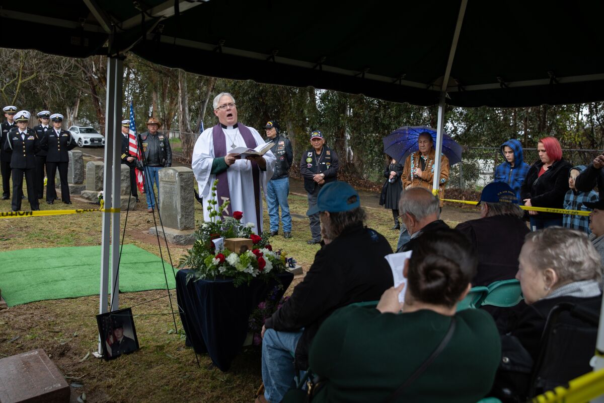 Family members and friends at a ceremony for Army Pfc. Thomas F. Green, killed in the Vietnam War, at Nuevo Memory Gardens. 