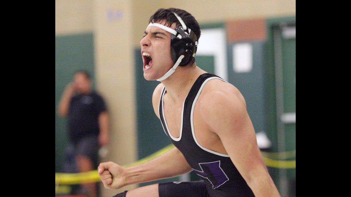 Hoover's Murad Muradyan screams after pinning San Marino's Adrian Licon in the Rio Hondo League wrestling championships at Monrovia School on Wednesday, Feb. 10, 2016.