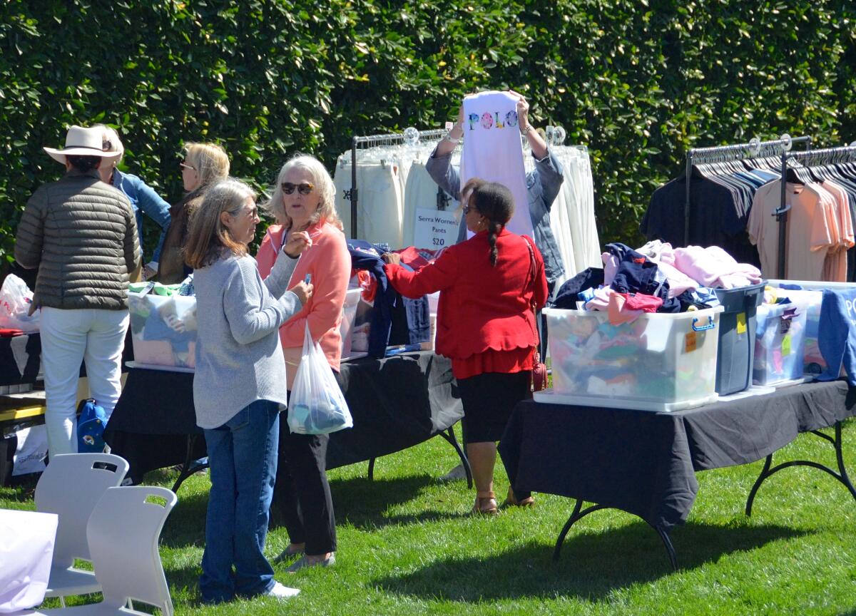 Attendees shop at the pop-up "Hanger" boutique on the Newport Beach Civic Center lawn.
