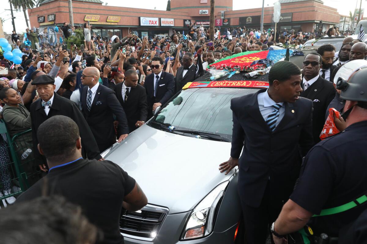 The Nipsey Hussle Celebration of Life procession moves through South Los Angeles.