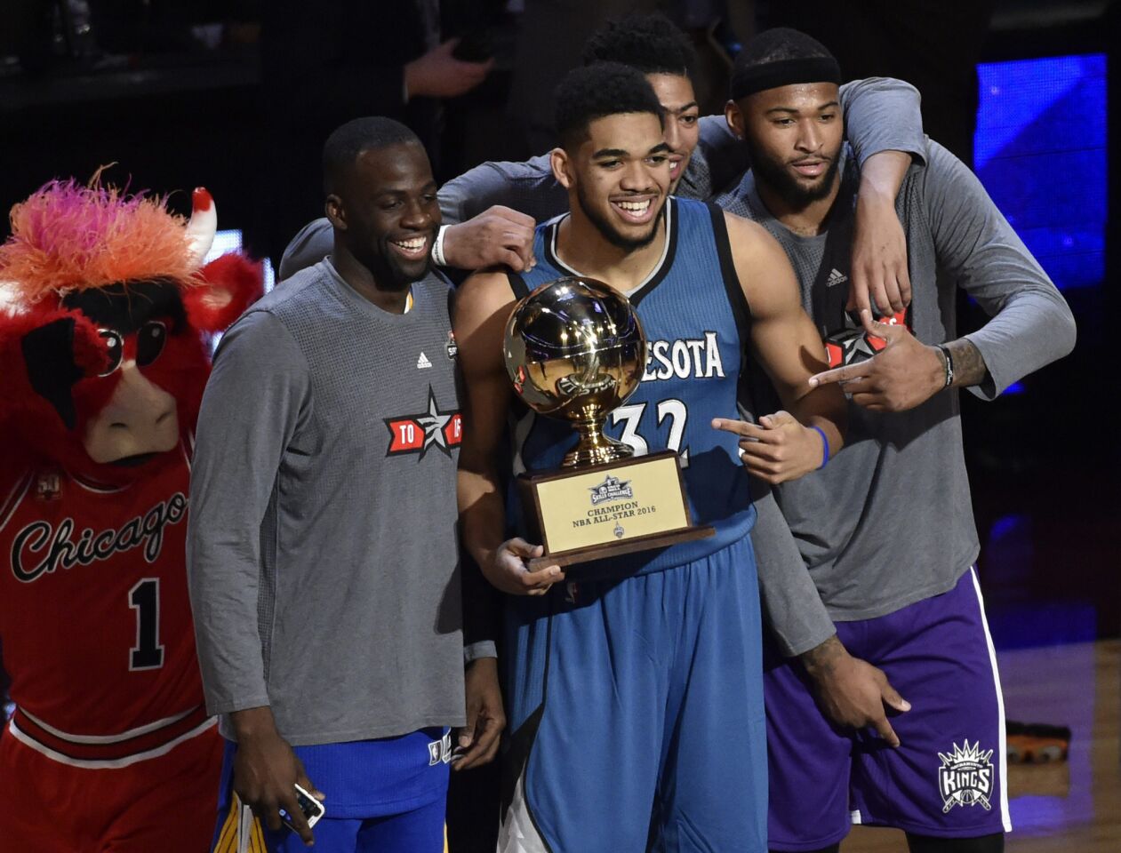 Timberwolves forward Karl-Anthony Towns holds his Skills Challenge trophy while taking a photo with (from left) Warriors forward Draymond Green, Pelicans forward Anthony Davis and Kings center DeMarcus Cousins.