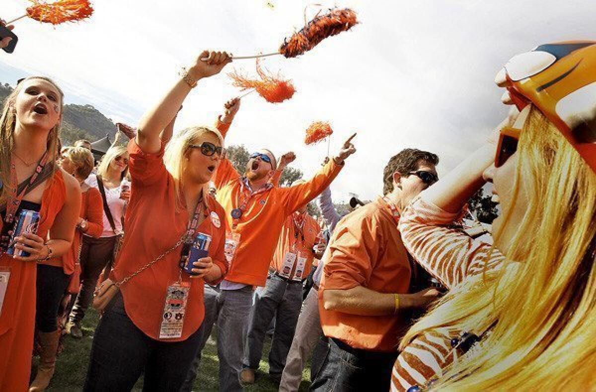 Auburn fans (from left) Amy Camp, Apryl Camp, Taylor Norris and Paige Davis attend a tailgate party before the BCS championship game between Florida State and Auburn on Monday at the Rose Bowl in Pasadena.