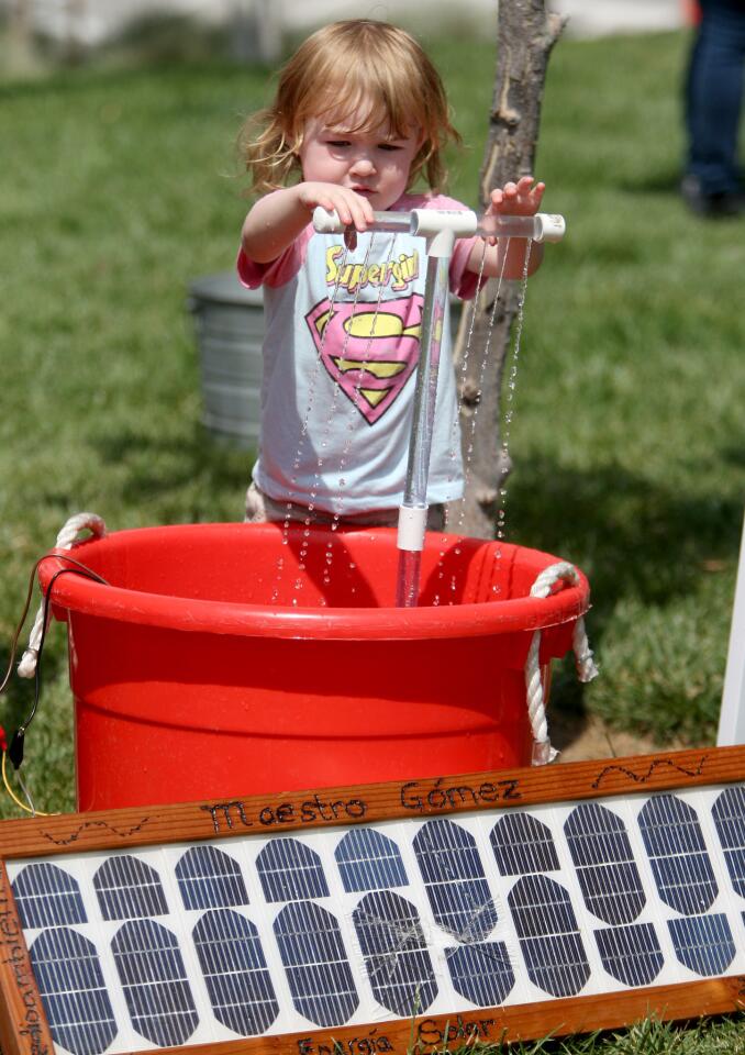 Three-year old Elisabeth (cq) Moreno, of L.A., checks out a solar water fountain at the city of Glendale's Earth Day 2016 at Central Park on Glendale on Saturday, April 30, 2016. The event included a variety of vendors, music and food preparation demos.