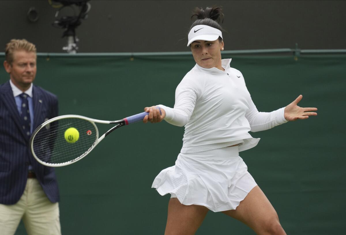 Canada's Bianca Andreescu plays a return to Alize Cornet of France during the women's singles first round match on day three of the Wimbledon Tennis Championships in London, Wednesday June 30, 2021. (AP Photo/Alberto Pezzali)