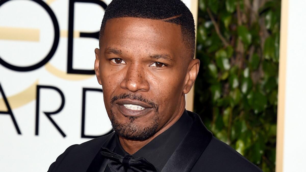 Actor Jamie Foxx is said to have saved a man from a burning car that overturned in front of his home.