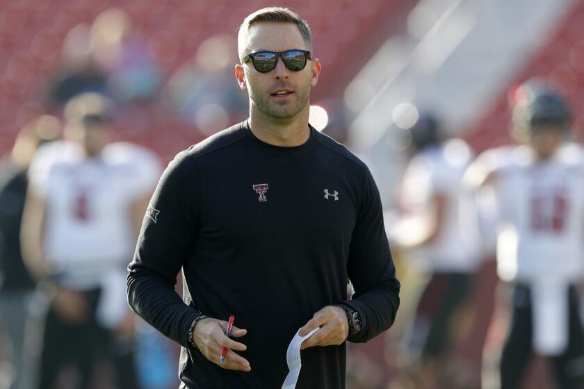 File-This Oct. 27, 2018, file photo shows Texas Tech head coach Kliff Kingsbury standing on the field before an NCAA college football game against Iowa State, in Ames, Iowa. A win in their regular season finale at Texas last season likely saved Kingsburys job. It is unclear what impact, if any, the outcome of this game might have on Kingsburys future. Dealt with a lot of that last year, and this year the focus has just been on our team and our program and these seniors, and so that's what my focus is this week is, hey, how can we extend this season for these seniors, Kingsbury said. (AP Photo/Charlie Neibergall, File)