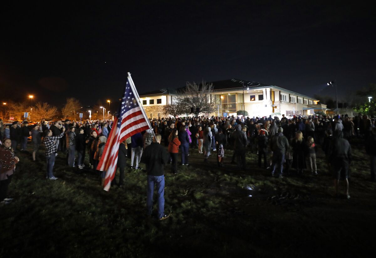 People attend a rally at the Cameron Family YMCA in Santee.
