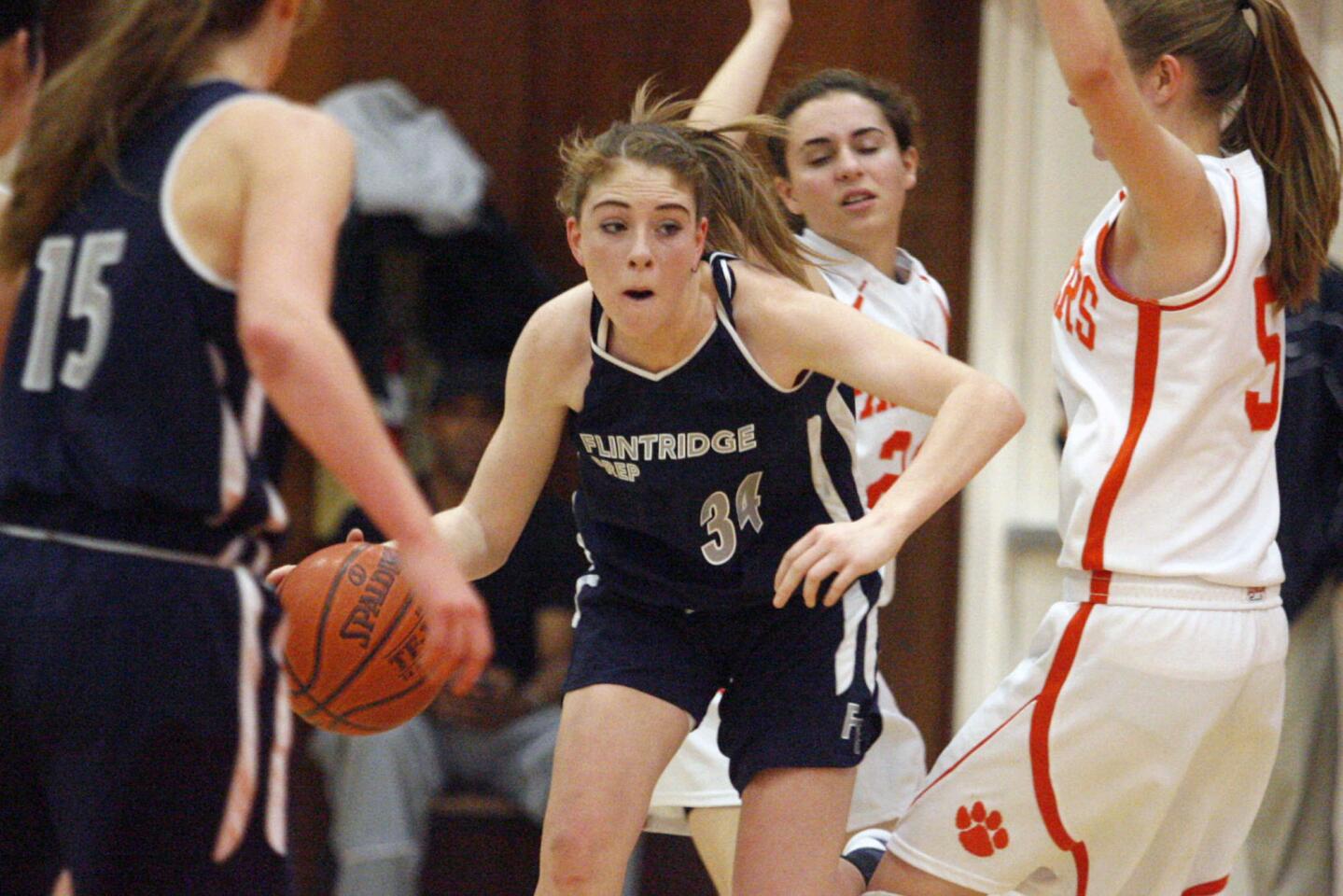 Flintridge Prep's Tala Ismail drives to the basket during a game against Pasadena Poly at Pasadena Poly on Saturday, February 2, 2013.