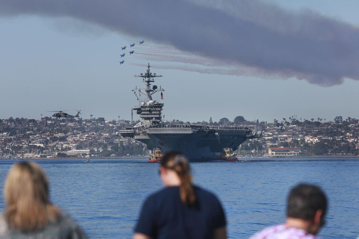 The Carl Vinson coming into San Diego Harbor as the Blue Abgels do a fly-over 