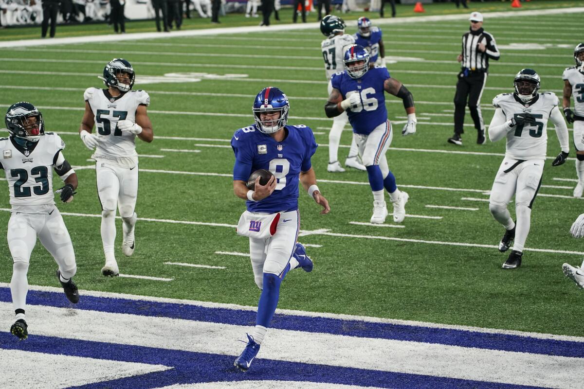 New York Giants quarterback Daniel Jones runs for the end zone against the Philadelphia Eagles on Sunday.
