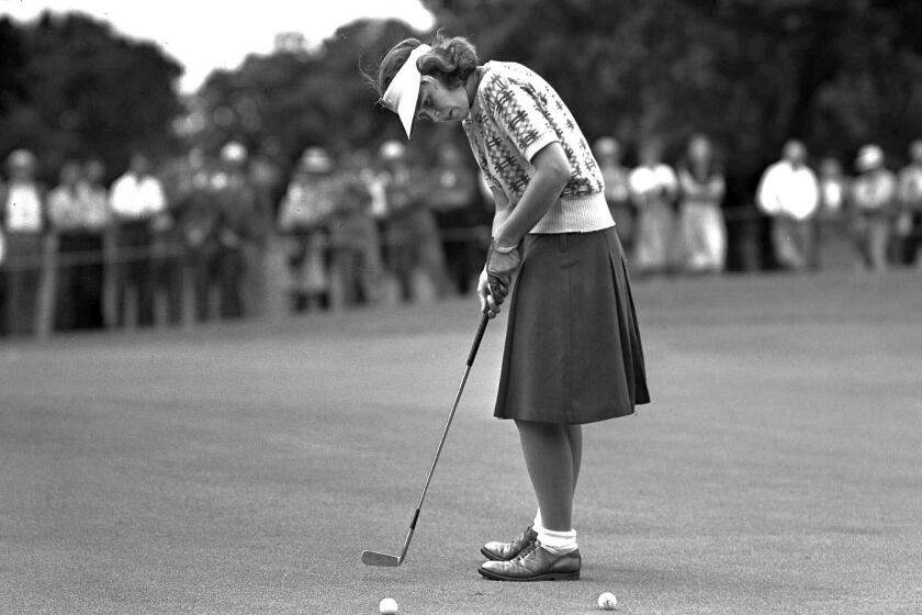  Shirley Spork sinks a short putt on the green during the Women's Western Open Golf tournament at Des Moines, Iowa, in 1946