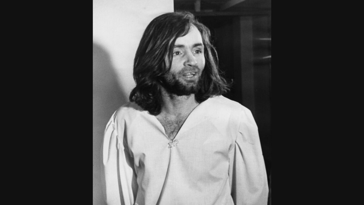 Charles Manson is led back to his cell after a court appearance in 1970.
