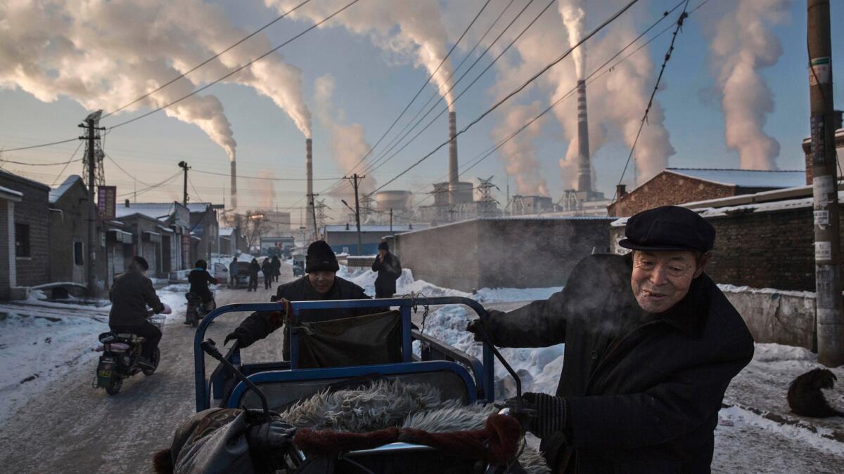Smoke billows from factories in Shanxi, China, in 2015.