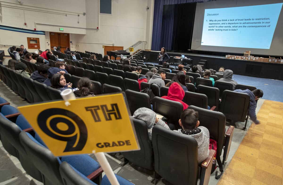 Reseda High School vice principal Phyllis Castaneda clicks through a slide presentation in the campus auditorium as students at the school are in the school auditorium and gym as UTLA teachers are out on strike in Reseda.