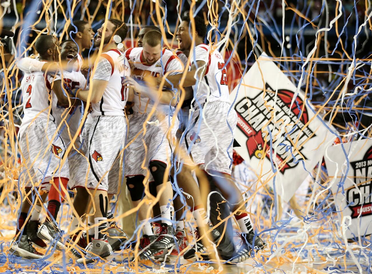 The Louisville Cardinals celebrate after they won 82–76 against the Michigan Wolverines during the 2013 NCAA Men's Final Four Championship at the Georgia Dome on April 8, 2013 in Atlanta, Georgia.