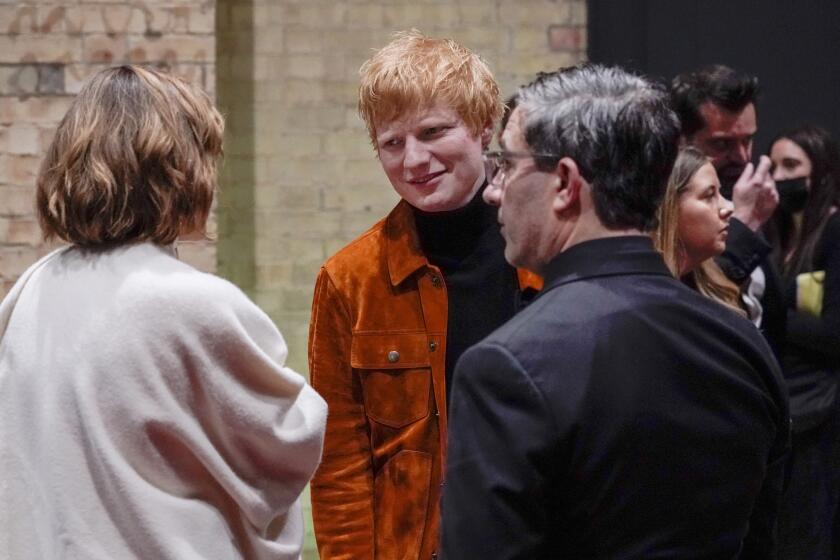 FILE - In this Sunday, Oct. 17, 2021 file photo, British singer Ed Sheeran attends the first ever Earthshot Prize Awards Ceremony at Alexandra Palace in London. On Sunday, Oct. 24, 2021, Sheeran said he has tested positive for COVID-19 and will do interviews and performances from his house while he self-isolates. (AP Photo/Alberto Pezzali, Pool)