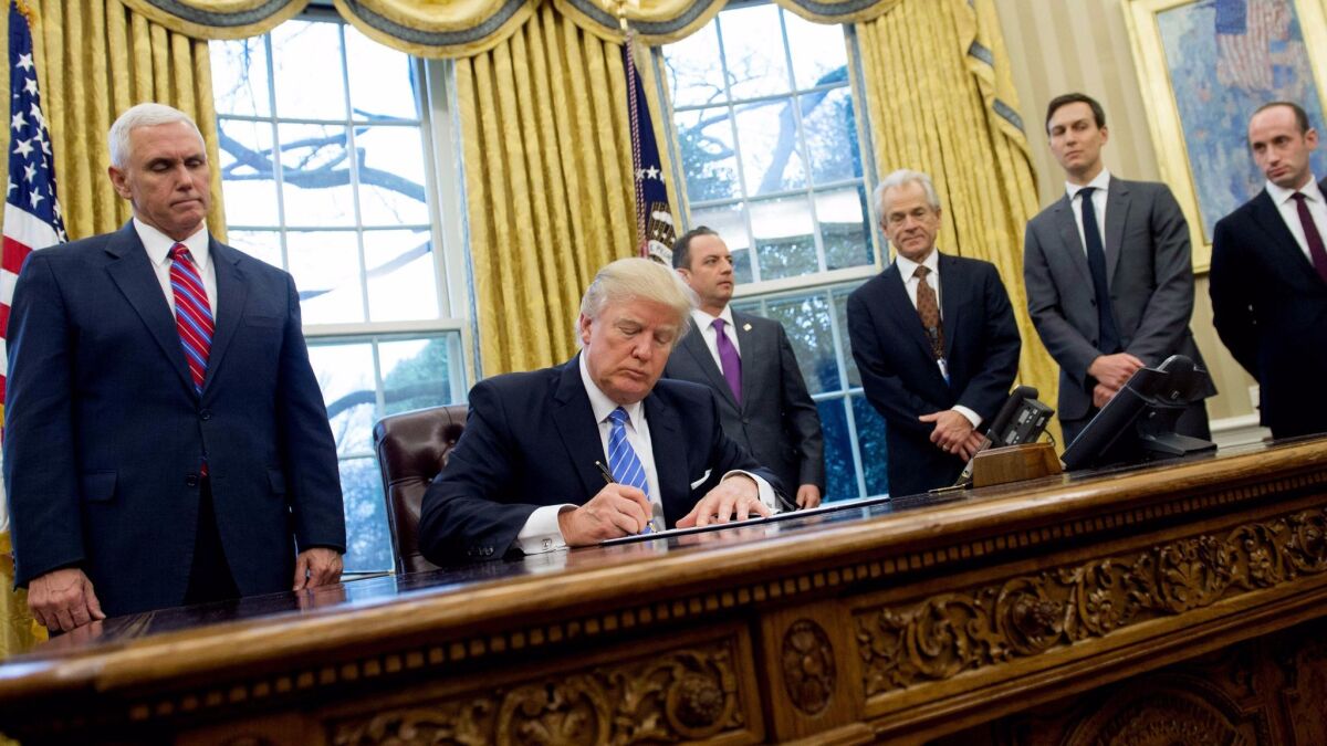 President Trump, shown signing an executive order, has repeatedly stated he would terminate the North American Free Trade Agreement if it could not be significantly improved in favor of American interests.