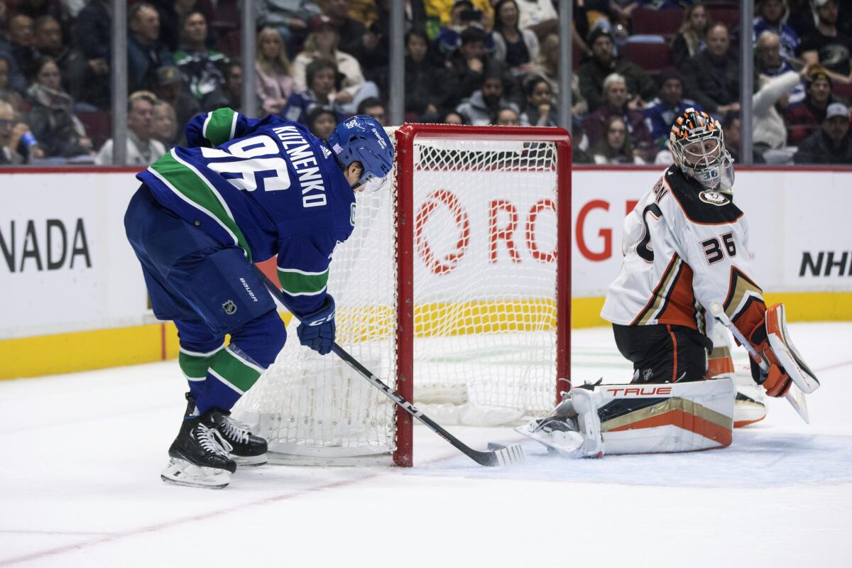 Vancouver Canucks' Andrei Kuzmenko (96) scores a goal against Anaheim Ducks goalie John Gibson (36) during the third period of an NHL hockey game Thursday, Nov. 3, 2022, in Vancouver, British Columbia. (Ben Nelms/The Canadian Press via AP)