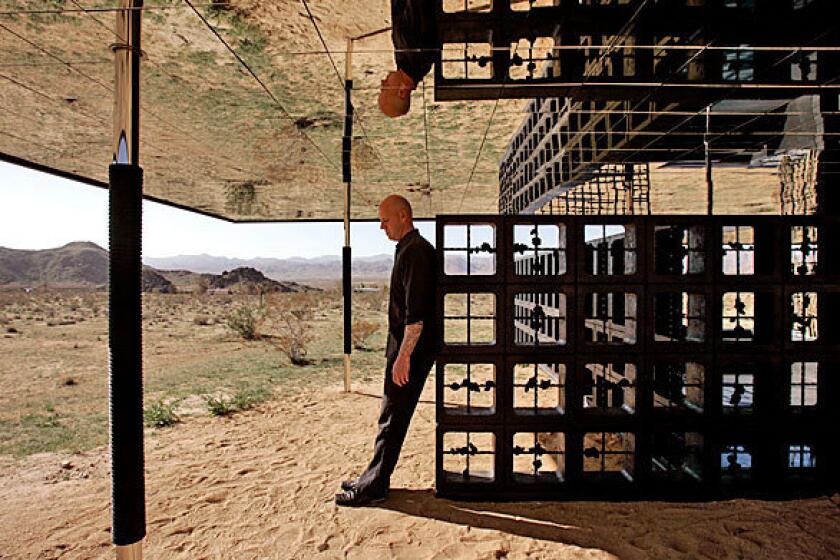 By Barbara Thornburg Robert Stone — former punk rocker, studio artist and now architect — has built a one-bedroom retreat called Rosa Muerta on the outskirts of Joshua Tree. Chrome columns rise from the sandy desert floor to support a ceiling plane clad with mirrors. Stone left the arid landscape that surrounds the property unaltered. "My architectural practice is more related to how artists work," he says. "I'm trying to do something amazing here. I learned as a kid doing my music that you have a right to come up with something brand new."