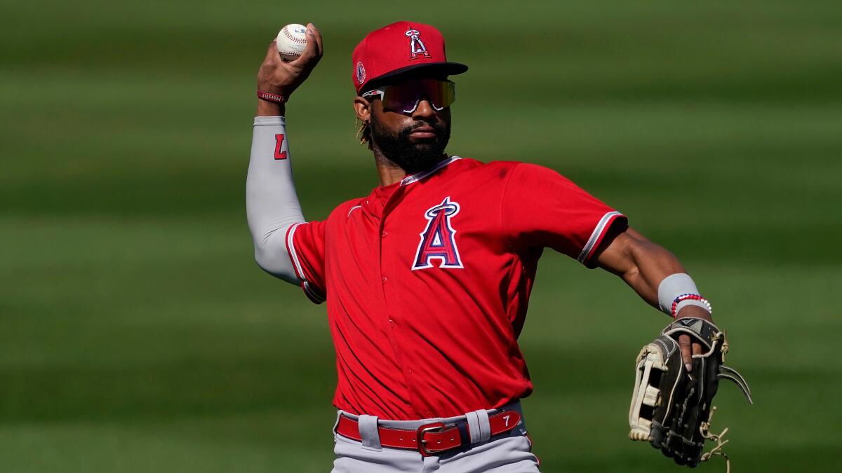 Angels center fielder Jo Adell throws during a spring training baseball game against the Arizona Diamondbacks.